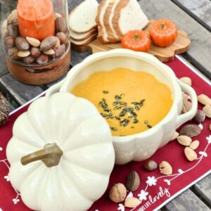 pumpkin butternut squash soup in large white pumpkin bowl