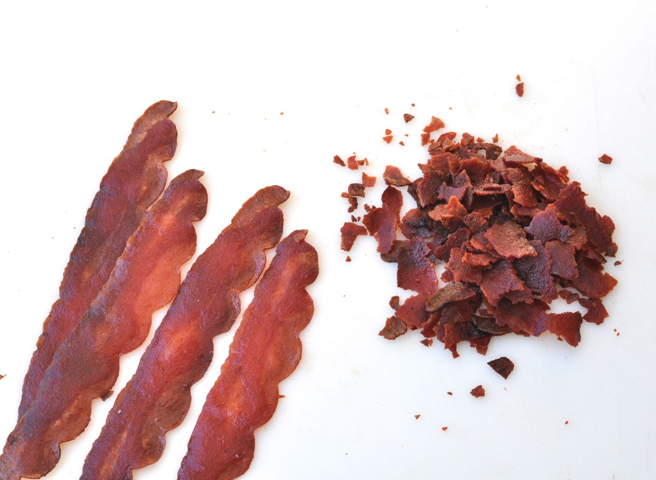 strips of bacon and crumbled bacon pieces