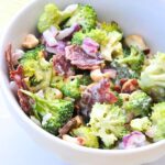 healthy broccoli salad in white bowl