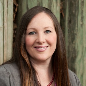 woman with long brown hair wearing gray sweater