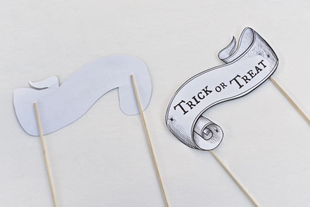 two halloween banners on sticks