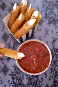 Witch fingers mozzarella sticks with bloody marinara dipping sauce. The perfect Halloween snack in less than 20 minutes!