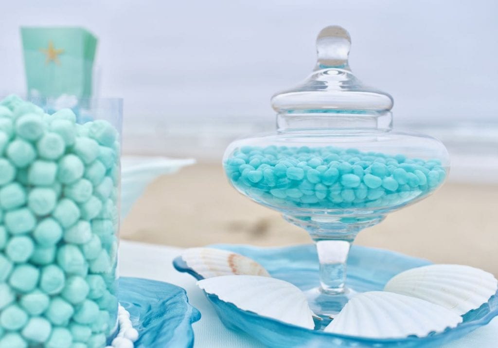 Blue candy buffet at beach wedding with ocean theme