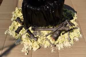Fake fire prop with spray foam and bones