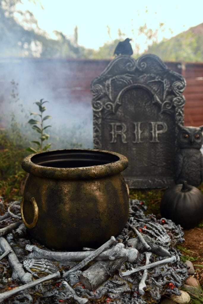 Fake fire with bones, cauldron, and headstone