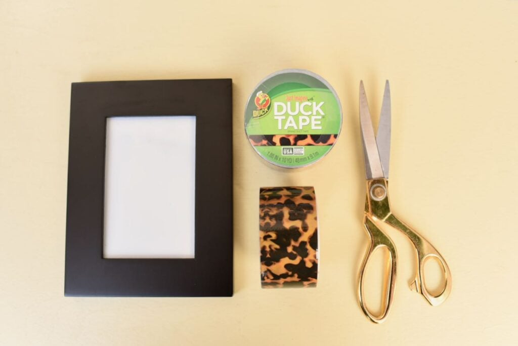 picture frame, duck tape, and scissors
