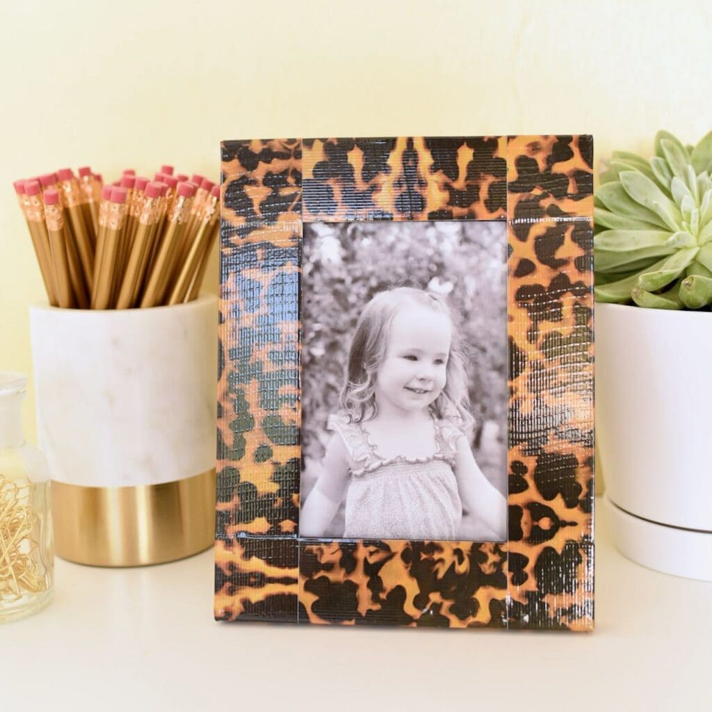 girl's photo in picture frame with duct tape