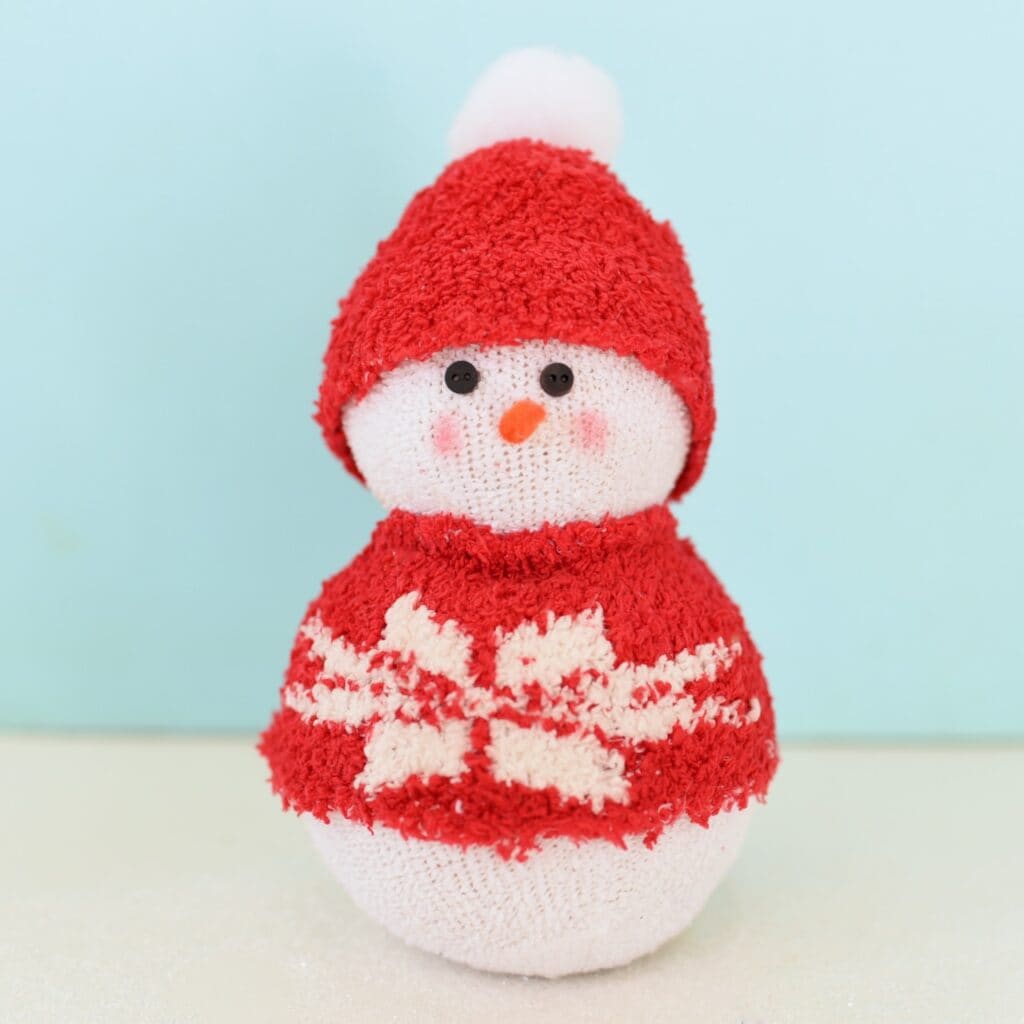 snowman with red hat and sweater