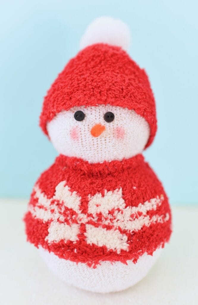 diy sock snowman with red sweater and hat