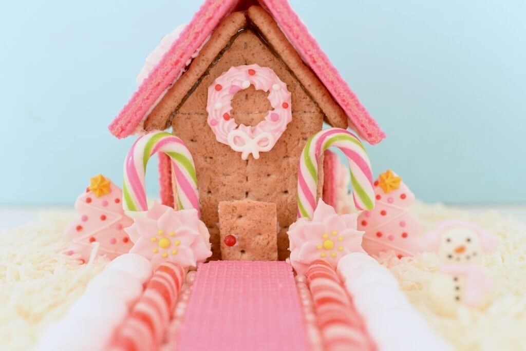 pink and white graham cracker gingerbread house