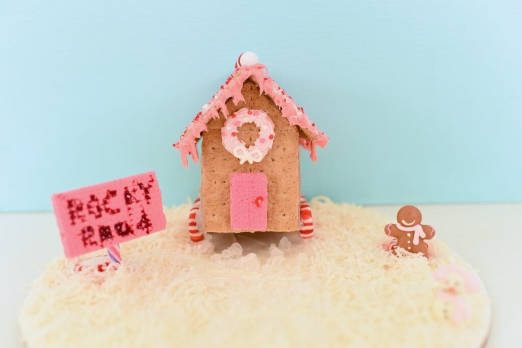 little house with pink frosting roof