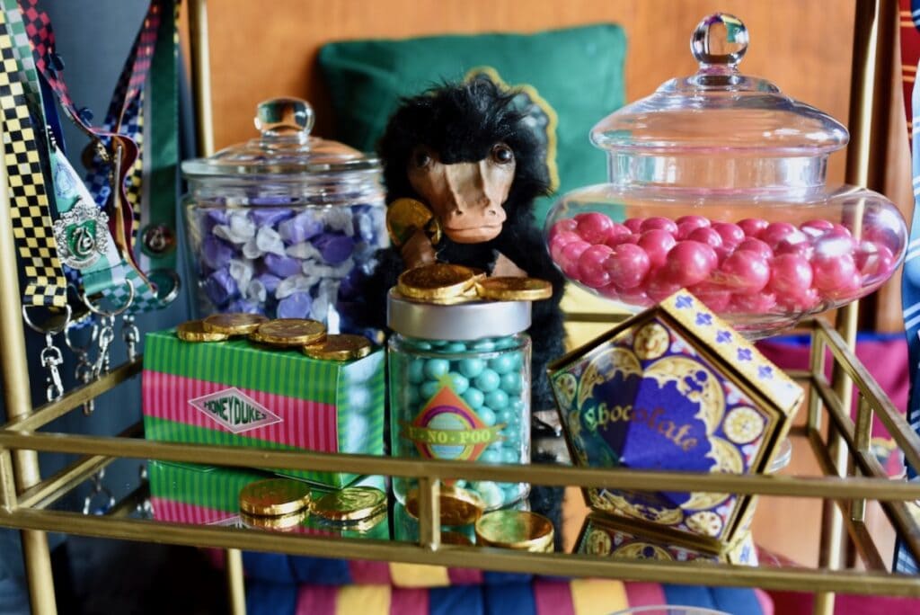 Harry Potter candies in jars on gold cart