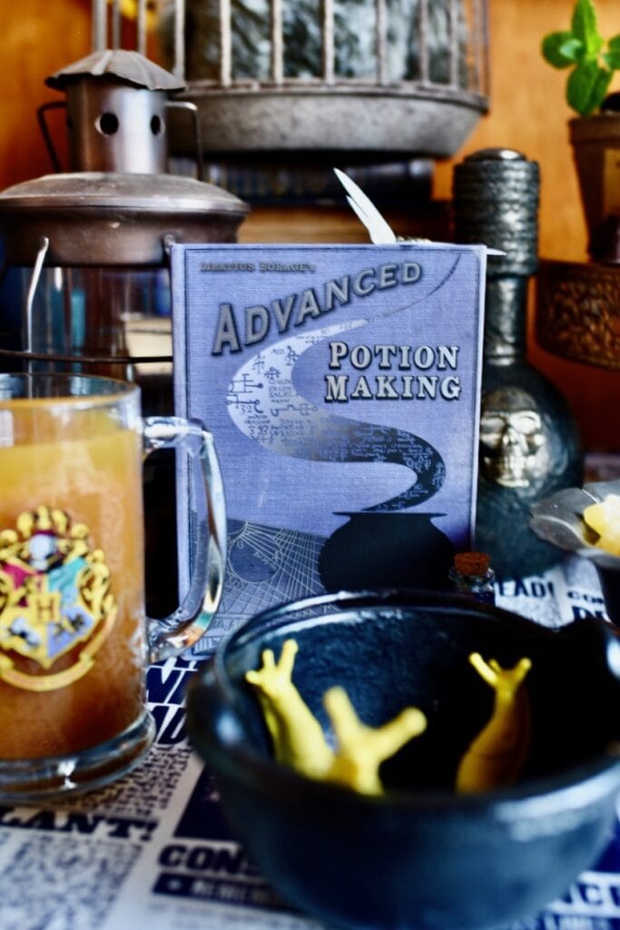 purple advanced potion making book and yellow slugs