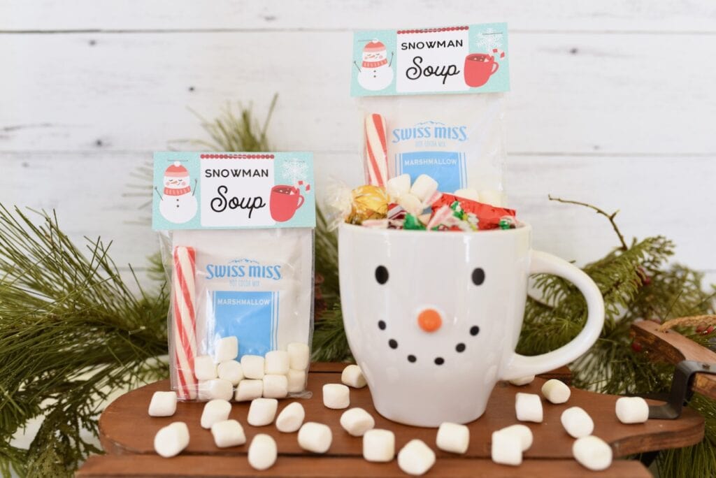white snowman mug with candy and snowman soup inside