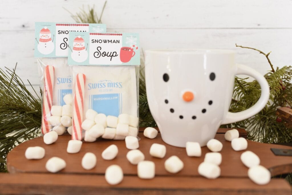 snowman soup packets with marshmallows and peppermint stick