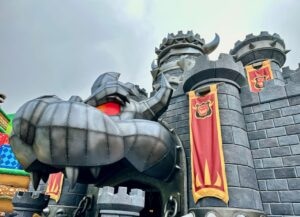 big gray castle with creature in front
