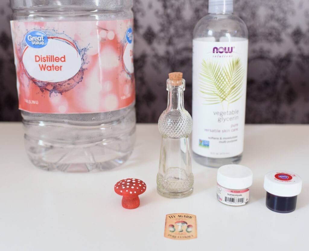 glass bottle next to vegetable glycerin and distilled water