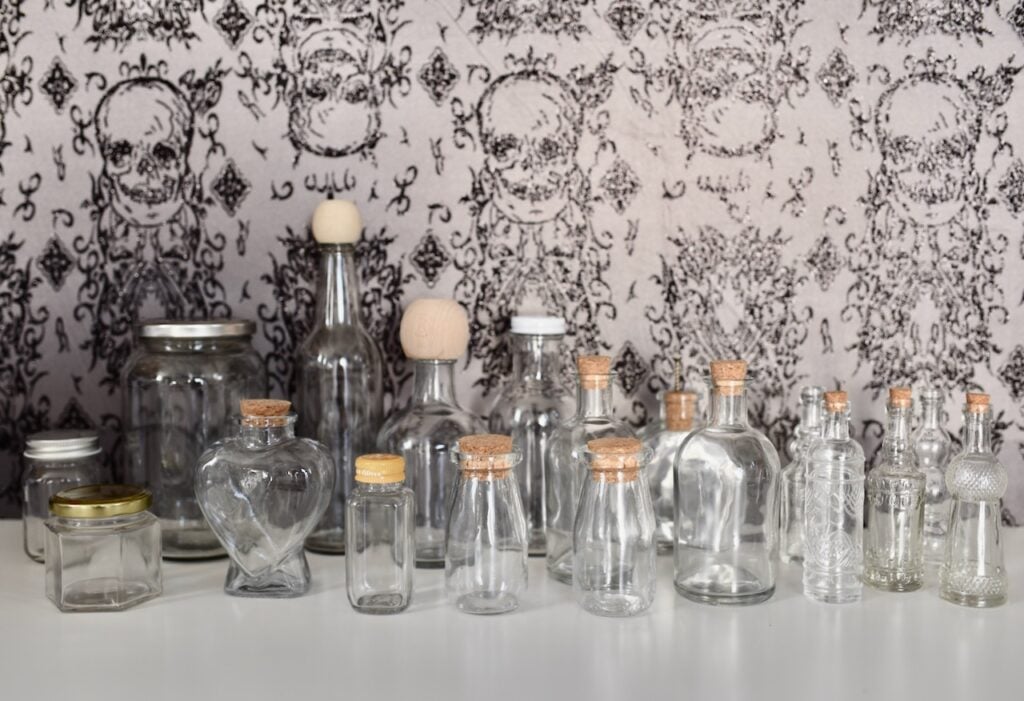 Glass bottles and jars with corks on top