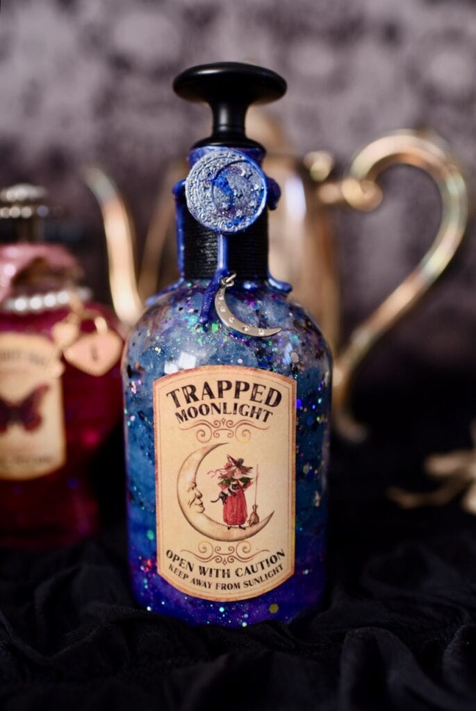 Blue and purple potion bottle with trapped moonlight label on front