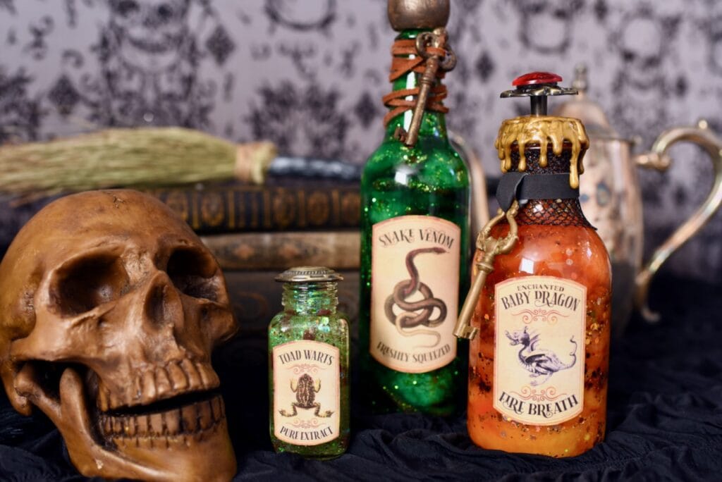 Halloween potion bottles next to skull