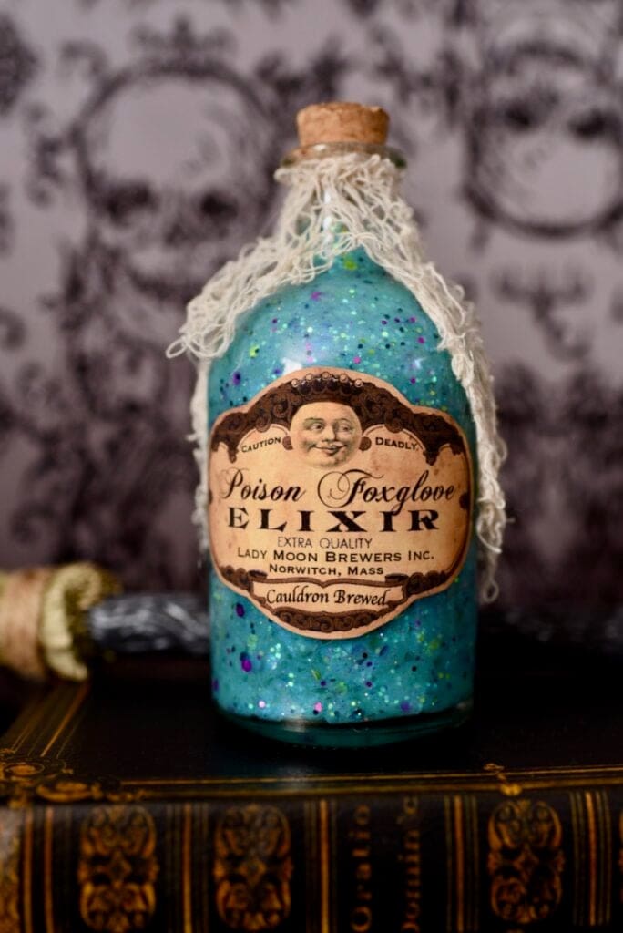 light blue potion with glitter inside Halloween potion bottle