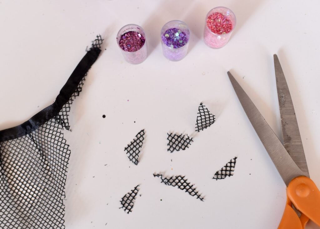 scissors next to cut black tulle pieces