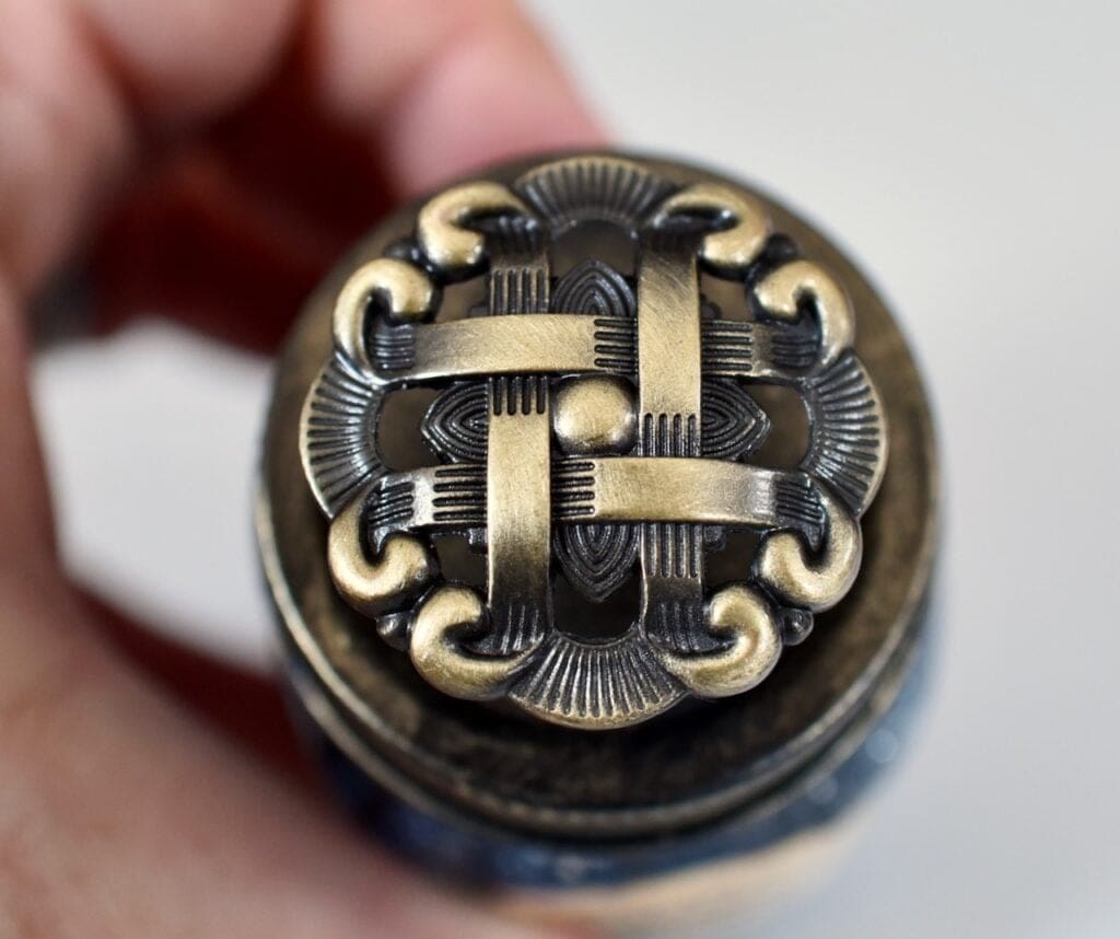 medal design on top of glass bottle