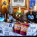 harry potter party with harry wanted poster in gold frame
