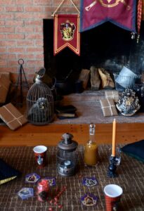 large brick fireplace with red Gryffindor flag hanging