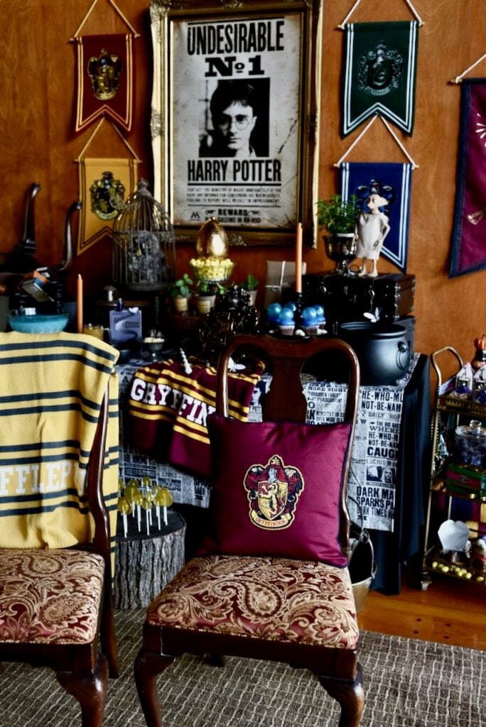 Harry Potter poster on wall with two dining chairs