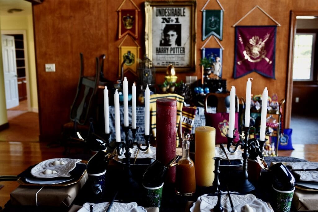 dining table with white candle in black candelabra