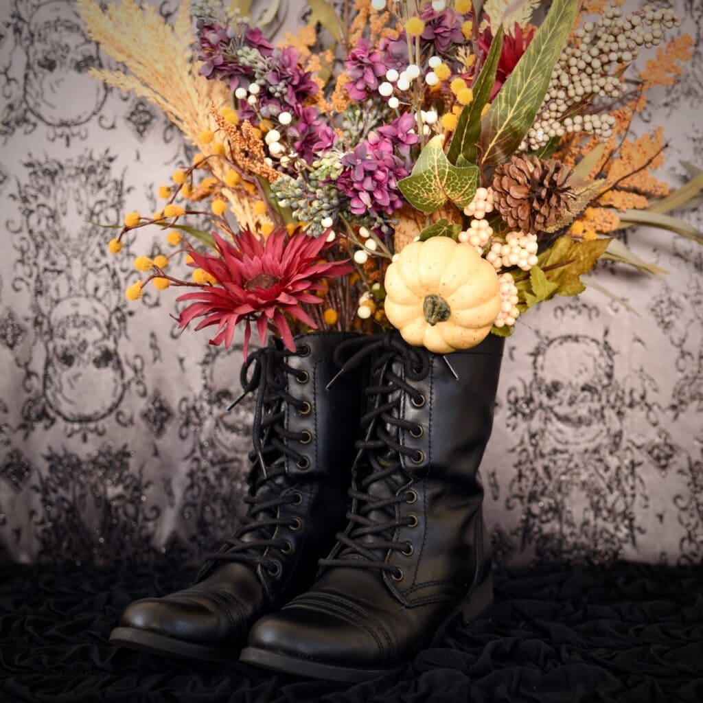 witch boots with fall flowers inside
