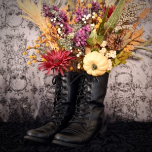 witch boots with fall flowers inside