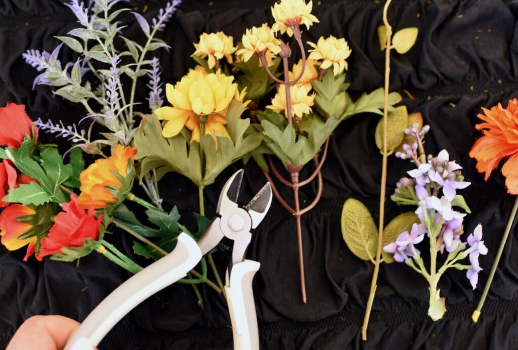 cut flower stems next to cutting tool