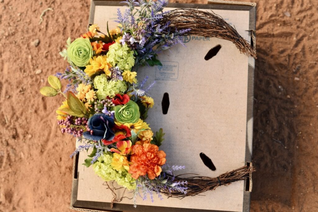 floral moon wreath on cardboard box