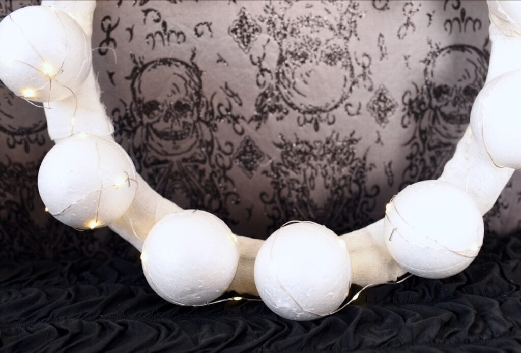 white foam balls on white wreath form