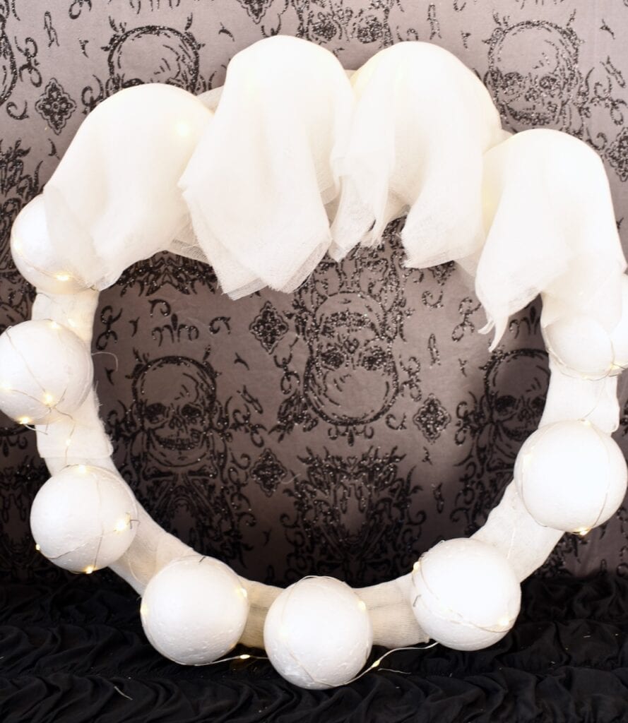 cheesecloth ghosts and foam baslls on wreath form