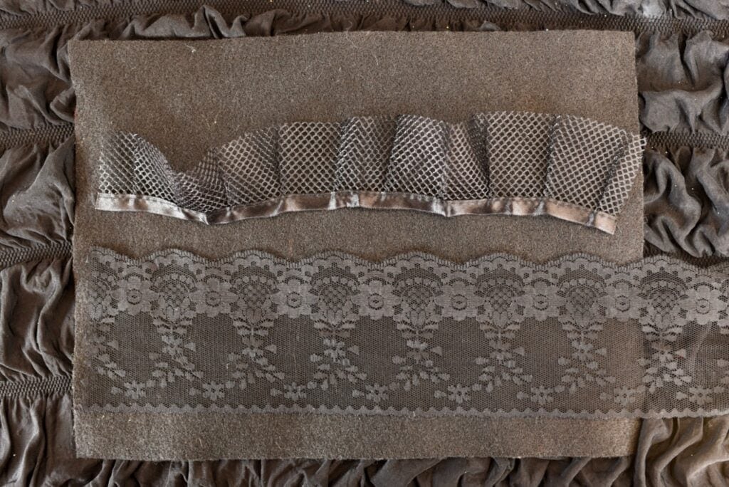 black lace and trim on piece of black felt