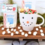 snowman soup with label inside snowman mug with marshmallows