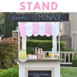 wooden lemonade stand with a pink and white awning