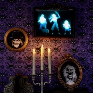 hitchhiking ghosts mirror with blue lit up ghosts hanging on the wall